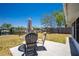 A backyard view with patio seating and views of the waterfront, showing outdoor relaxation at 159 Godfrey Ne Ave, Port Charlotte, FL 33952