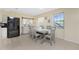 Bright dining area featuring modern décor and convenient access to kitchen at 159 Godfrey Ne Ave, Port Charlotte, FL 33952