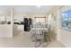 Cozy dining area with modern furniture and ample natural light from nearby windows at 159 Godfrey Ne Ave, Port Charlotte, FL 33952