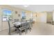 Open-concept dining area with natural light and a contemporary table set at 159 Godfrey Ne Ave, Port Charlotte, FL 33952