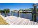 Private wooden dock, offering an ideal spot for boating, fishing, and enjoying waterfront living at 159 Godfrey Ne Ave, Port Charlotte, FL 33952