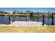 Private wooden dock, perfect for boating, fishing, and enjoying waterfront living with boat lift at 159 Godfrey Ne Ave, Port Charlotte, FL 33952