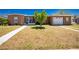 Attractive home exterior with a tidy front yard, walkway, and attached garage at 159 Godfrey Ne Ave, Port Charlotte, FL 33952