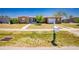 Inviting home exterior with a well-maintained lawn, mailbox, and a charming tree at 159 Godfrey Ne Ave, Port Charlotte, FL 33952