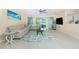 Bright living room featuring stylish furniture, tile floors, and sliding glass doors at 159 Godfrey Ne Ave, Port Charlotte, FL 33952