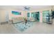 Cozy living room featuring modern furniture and tile floors for easy maintenance at 159 Godfrey Ne Ave, Port Charlotte, FL 33952