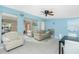Spacious living area with a modern fan, neutral furniture, and a bright, airy feel at 159 Godfrey Ne Ave, Port Charlotte, FL 33952