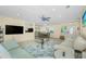 Open concept living room with tile floors, ample seating, and easy access to other rooms at 159 Godfrey Ne Ave, Port Charlotte, FL 33952