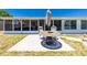 Outdoor patio with furniture, overlooking a screened-in porch and sunny backyard, perfect for entertaining at 159 Godfrey Ne Ave, Port Charlotte, FL 33952