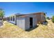Exterior of a backyard storage shed, complemented by the home's architecture at 159 Godfrey Ne Ave, Port Charlotte, FL 33952