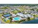 Community aerial view of the pool, clubhouse, tennis courts and green space at 1678 Royal Ct, Punta Gorda, FL 33980