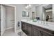 Well-appointed bathroom featuring double sinks, dark wood cabinets, and modern fixtures at 1678 Royal Ct, Punta Gorda, FL 33980