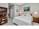 Inviting bedroom featuring tile floors, neutral walls, and a comfortable double bed with floral accents at 1678 Royal Ct, Punta Gorda, FL 33980