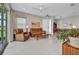 Spacious living area with tile flooring, comfortable seating, and a view of the outdoor patio at 1678 Royal Ct, Punta Gorda, FL 33980