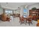 Bright open-concept living room and dining area with natural light and a view of the lanai at 1678 Royal Ct, Punta Gorda, FL 33980