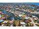 Wide aerial view showing neighborhood featuring waterfront homes with canal access at 1711 Boca Raton Ct, Punta Gorda, FL 33950