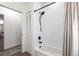 Bright bathroom featuring a tub-shower combo with a modern shower head at 1711 Boca Raton Ct, Punta Gorda, FL 33950