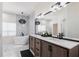Bright bathroom with a soaking tub, dual sink vanity, and a sleek, modern design at 1711 Boca Raton Ct, Punta Gorda, FL 33950