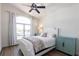 Bright bedroom with a large window overlooking the water and a coastal-inspired decor at 1711 Boca Raton Ct, Punta Gorda, FL 33950