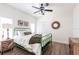 Charming bedroom with hardwood floors, a green bed frame, and neutral decor at 1711 Boca Raton Ct, Punta Gorda, FL 33950