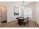 Cozy dining area with a dark wood table, comfortable seating, and a modern light fixture at 1711 Boca Raton Ct, Punta Gorda, FL 33950