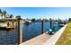 Waterfront dock area with boat lifts and serene water views at 1711 Boca Raton Ct, Punta Gorda, FL 33950