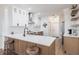 Contemporary kitchen with sleek white cabinets, stainless steel appliances, and a functional peninsula at 1711 Boca Raton Ct, Punta Gorda, FL 33950
