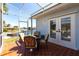 The airy lanai offers water views with comfortable seating and tile floors at 1711 Boca Raton Ct, Punta Gorda, FL 33950