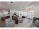 Spacious living room with wood floors, stylish furniture, and an open floor plan at 1711 Boca Raton Ct, Punta Gorda, FL 33950