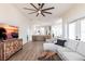 Open-concept living room flows into a kitchen with island, offers bright and airy interior at 1711 Boca Raton Ct, Punta Gorda, FL 33950