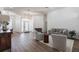 Bright living room featuring wood floors, a comfortable sofa, and modern decor at 1711 Boca Raton Ct, Punta Gorda, FL 33950