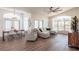 Bright living area with large windows, modern furnishings, and seamless integration with dining space at 1711 Boca Raton Ct, Punta Gorda, FL 33950