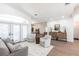 Inviting living room with wood floors, a neutral sofa, and a decorative cabinet at 1711 Boca Raton Ct, Punta Gorda, FL 33950