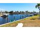 Waterfront view showcasing boat dock and calm canal waters at 1711 Boca Raton Ct, Punta Gorda, FL 33950
