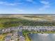 This aerial captures a tranquil waterfront community, set against an expansive landscape at 17459 Palmetto Pass Ln, Punta Gorda, FL 33982