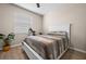 This bedroom features hard wood floors, a neutral color scheme, and large window at 17459 Palmetto Pass Ln, Punta Gorda, FL 33982