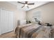 This bedroom features hard wood floors, a neutral color scheme, closet and large window at 17459 Palmetto Pass Ln, Punta Gorda, FL 33982