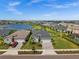 Exterior showcases well-manicured lawns and scenic lake views at 17459 Palmetto Pass Ln, Punta Gorda, FL 33982