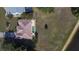 Aerial view of the home showcasing the layout, tile roof, pool, and proximity to the water at 1856 Nuremberg Blvd, Punta Gorda, FL 33983