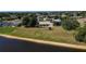 Aerial shot showcases a home in a community overlooking a waterway on an oversized lot at 1856 Nuremberg Blvd, Punta Gorda, FL 33983