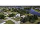 An aerial view of a home in a beautiful community with winding waterways and lush trees at 1856 Nuremberg Blvd, Punta Gorda, FL 33983