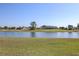 Beautiful waterfront view from the backyard, showcasing the tranquil pond at 1856 Nuremberg Blvd, Punta Gorda, FL 33983