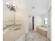 Bathroom showcasing a double vanity, and a separate soaking tub at 1856 Nuremberg Blvd, Punta Gorda, FL 33983