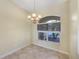 Bright dining area with tile flooring, chandelier, and view to the outside at 1856 Nuremberg Blvd, Punta Gorda, FL 33983