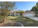 Inviting home showcasing a clay tile roof, mature landscaping, and a welcoming front entrance at 1856 Nuremberg Blvd, Punta Gorda, FL 33983