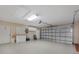 Spacious two car garage with door and a workbench area with cabinets at 1856 Nuremberg Blvd, Punta Gorda, FL 33983