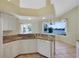 Bright kitchen featuring granite countertops, a breakfast bar, and a scenic view at 1856 Nuremberg Blvd, Punta Gorda, FL 33983
