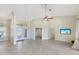 Spacious living room with ceiling fan and tile floors at 1856 Nuremberg Blvd, Punta Gorda, FL 33983