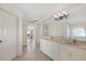Main bathroom with double sinks, and an arched entryway at 1856 Nuremberg Blvd, Punta Gorda, FL 33983