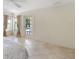 Main bedroom with tile flooring, neutral walls, ceiling fan, and natural light at 1856 Nuremberg Blvd, Punta Gorda, FL 33983